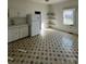 Bright kitchen with updated refrigerator, sink, and patterned tile floor at 2824 N Brevard St, Charlotte, NC 28205