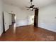 Living room with hardwood floors and a white fireplace at 2824 N Brevard St, Charlotte, NC 28205