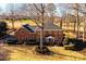 Two-story brick home with mature trees and circular driveway at 3467 Rock Bridge Dr, Conover, NC 28613