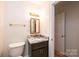 Updated bathroom with granite vanity and single sink at 3467 Rock Bridge Dr, Conover, NC 28613