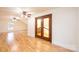 Large bonus room with hardwood floors and ceiling fan at 3467 Rock Bridge Dr, Conover, NC 28613