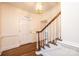 Bright entryway with hardwood floors and elegant staircase at 3467 Rock Bridge Dr, Conover, NC 28613