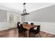 Bright dining area with hardwood floors and a live edge table at 3801 Melshire Ln, Charlotte, NC 28269