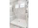 Spa-like bathroom with a large shower, built-in bench, and marble tile at 4003 Grace Pointe Dr # 99, Wesley Chapel, NC 28079