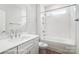 Clean bathroom featuring a bathtub, shower, and white tiled walls at 4003 Grace Pointe Dr # 99, Wesley Chapel, NC 28079
