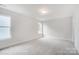Spacious bedroom with neutral carpeting and large windows at 4003 Grace Pointe Dr # 99, Wesley Chapel, NC 28079