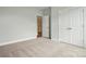 Carpeted bedroom with white walls and a double door closet at 4003 Grace Pointe Dr # 99, Wesley Chapel, NC 28079
