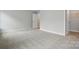 A bedroom featuring neutral colored walls, carpet, and trim at 4003 Grace Pointe Dr # 99, Wesley Chapel, NC 28079