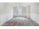 Formal dining room with chandelier and wainscoting at 4003 Grace Pointe Dr # 99, Wesley Chapel, NC 28079