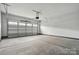 Spacious two car garage featuring a automatic garage door at 4003 Grace Pointe Dr # 99, Wesley Chapel, NC 28079