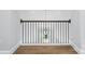 Hallway with iron railing and pendant lights at 4003 Grace Pointe Dr # 99, Wesley Chapel, NC 28079