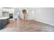 Open kitchen with an island, dark cabinets, and white countertops at 4003 Grace Pointe Dr # 99, Wesley Chapel, NC 28079
