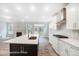 Open concept kitchen with island, stainless steel appliances, and white cabinets at 4003 Grace Pointe Dr # 99, Wesley Chapel, NC 28079