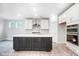 Modern kitchen with white cabinets, an island, and stainless steel appliances at 4003 Grace Pointe Dr # 99, Wesley Chapel, NC 28079