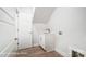 Compact laundry room with utility sink and ample cabinet storage at 4003 Grace Pointe Dr # 99, Wesley Chapel, NC 28079