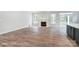 Spacious living room with hardwood floors and a fireplace at 4003 Grace Pointe Dr # 99, Wesley Chapel, NC 28079