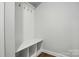 Mudroom area has overhead hooks, bench, and cubbies for storage and organization at 4003 Grace Pointe Dr # 99, Wesley Chapel, NC 28079