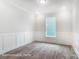 Bright office with wood-look floors and wainscoting at 4003 Grace Pointe Dr # 99, Wesley Chapel, NC 28079