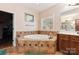 Bathroom with corner bathtub, double vanity, and walk-in closet at 416 Zelkova St, York, SC 29745