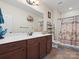 Well-lit bathroom featuring a large vanity, toilet, and shower, offering practicality and comfort at 416 Zelkova St, York, SC 29745