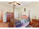 Bedroom with wood post bed, dresser, and ceiling fan at 416 Zelkova St, York, SC 29745