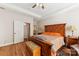Comfortable bedroom with king-size bed, hardwood floors, and an ensuite bathroom at 416 Zelkova St, York, SC 29745