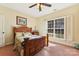 Bedroom with wood bed frame and large window with shutters at 416 Zelkova St, York, SC 29745