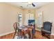 Cozy breakfast nook with a round table, two chairs, and a built-in fish tank at 416 Zelkova St, York, SC 29745