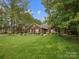 Well-maintained brick home with manicured lawn and mature trees at 416 Zelkova St, York, SC 29745