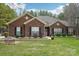 Brick ranch house with landscaped lawn and attached garage at 416 Zelkova St, York, SC 29745