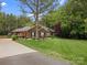 Lovely single-story brick home with lush front yard and mature trees at 416 Zelkova St, York, SC 29745