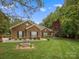 Brick home featuring an expanse of lawn and minimal landscaping at 416 Zelkova St, York, SC 29745
