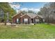 Brick ranch house with lush lawn and trees at 416 Zelkova St, York, SC 29745