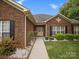 Inviting front entrance with a well-manicured walkway leading to a charming doorway and blossoming flowers at 416 Zelkova St, York, SC 29745