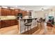 Modern kitchen with granite countertops, wooden cabinets, and a breakfast bar at 416 Zelkova St, York, SC 29745