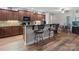Kitchen with granite countertops, wooden cabinets, and stainless steel appliances and an island at 416 Zelkova St, York, SC 29745