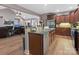 Open concept kitchen featuring granite countertops, stainless steel appliances and wooden cabinetry at 416 Zelkova St, York, SC 29745