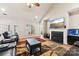 Living room with fireplace, hardwood floors, and large TV at 416 Zelkova St, York, SC 29745