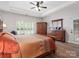 Serene main bedroom with hardwood floors, large windows, and elegant furniture at 416 Zelkova St, York, SC 29745