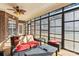 Bright sunroom with wicker furniture and screened windows at 416 Zelkova St, York, SC 29745