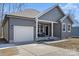 Gray house with white trim, a porch, and a two-car garage at 435 Mint St, Rock Hill, SC 29730