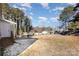 Large backyard with grassy area and trees at 504 E Poplar St, Dallas, NC 28034