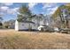 Large backyard with a view of neighboring houses at 504 E Poplar St, Dallas, NC 28034