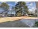 Large backyard with trees and shed at 504 E Poplar St, Dallas, NC 28034