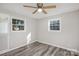 Bright bedroom with wood flooring and large windows at 504 E Poplar St, Dallas, NC 28034