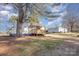 Cute bungalow with a large tree in the front yard at 504 E Poplar St, Dallas, NC 28034
