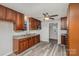 Modern kitchen with dark wood cabinets and granite countertops at 504 E Poplar St, Dallas, NC 28034