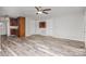 Spacious living area with wood-look floors and ceiling fan at 504 E Poplar St, Dallas, NC 28034