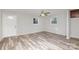 Bright living room with wood-look floors and lots of natural light at 504 E Poplar St, Dallas, NC 28034