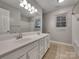 Bathroom with double vanity and updated fixtures at 7021 Acre Hill Ct, Charlotte, NC 28277